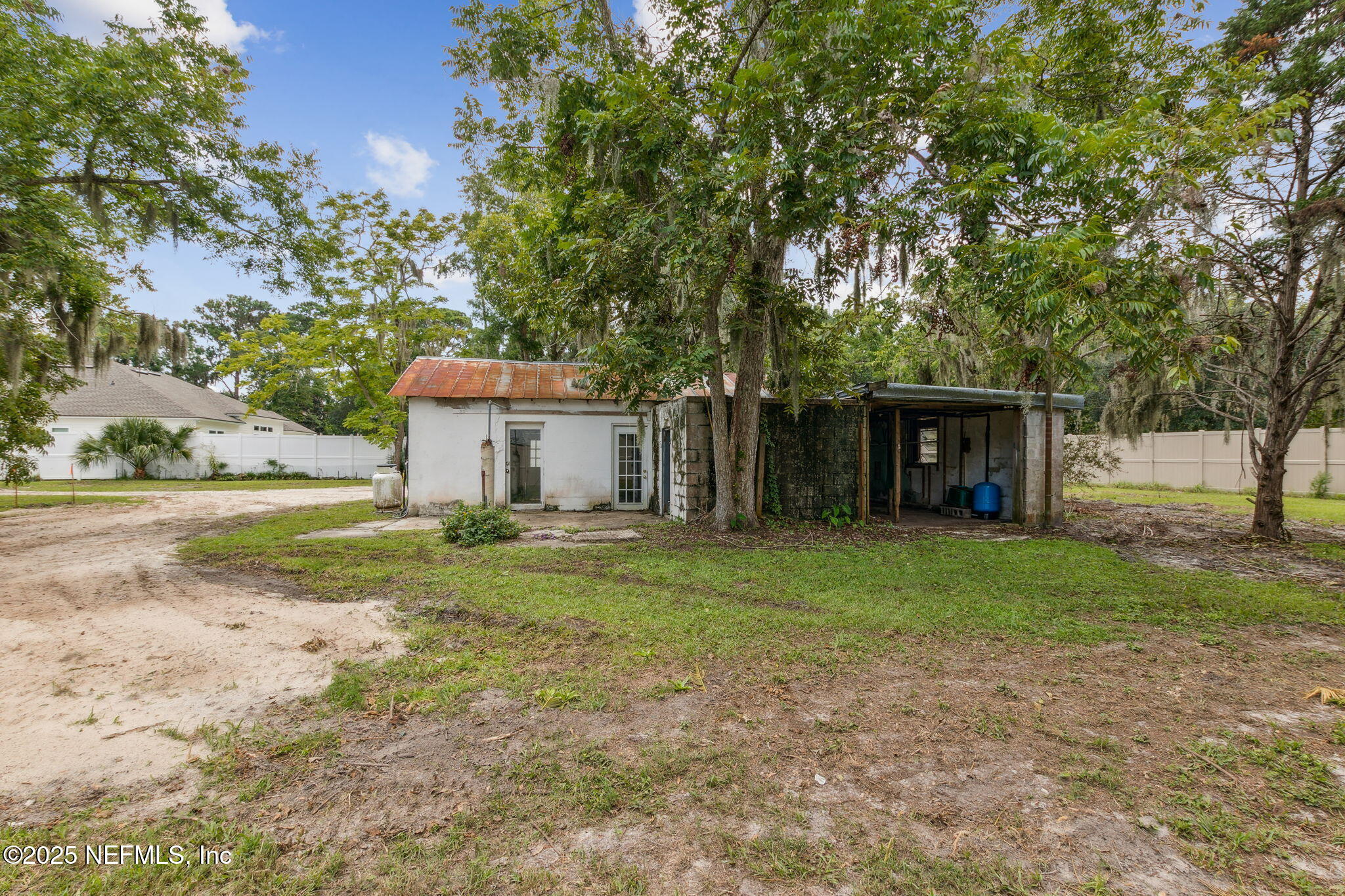 2753 Amelia Road Fernandina Beach, FL 32034 - Photo 37 of 40 a view of a house with backyard and a garden