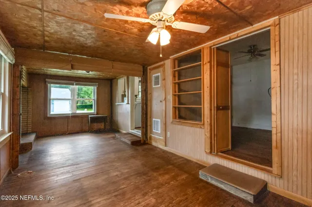 a view of an empty room with a window