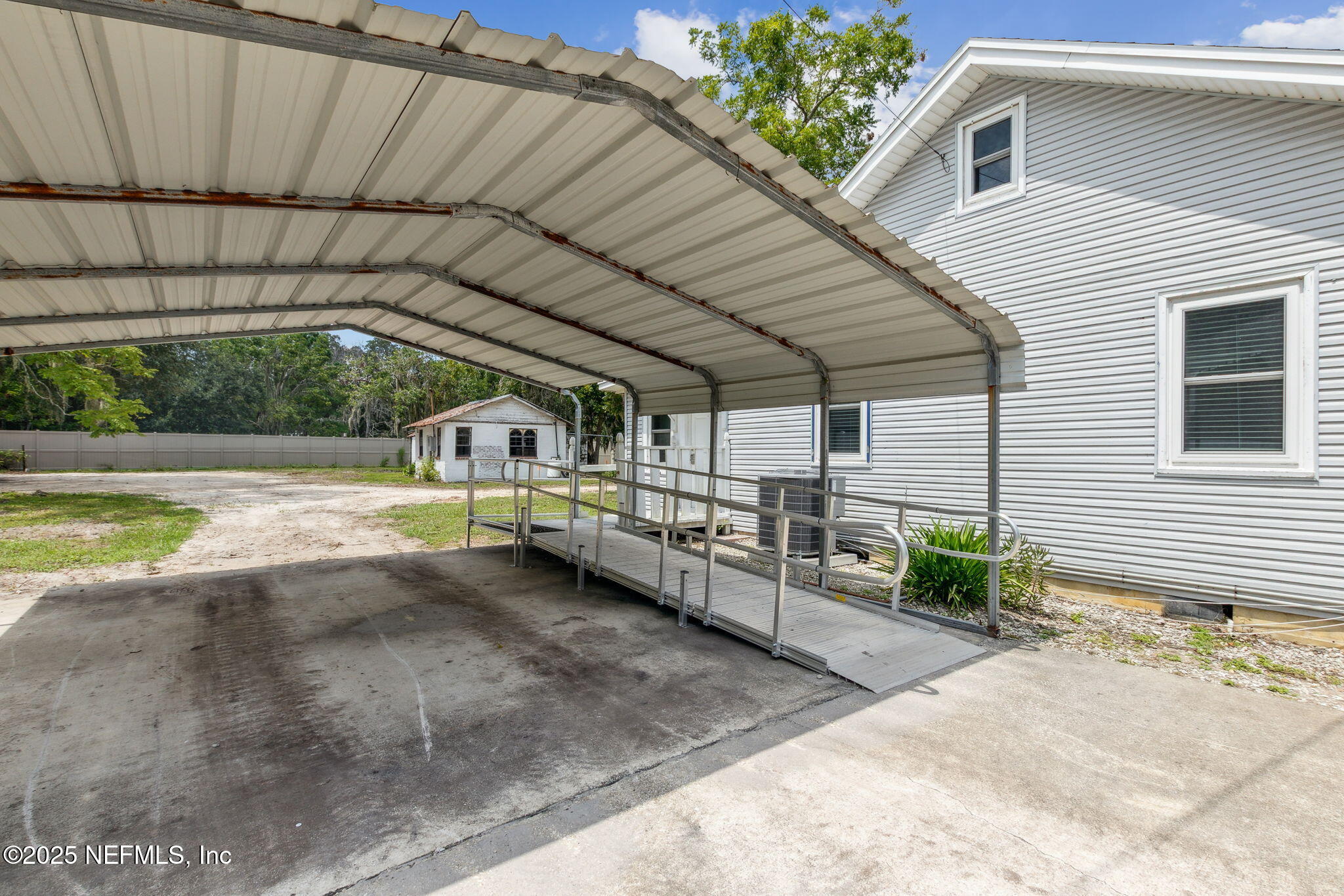 2753 Amelia Road Fernandina Beach, FL 32034 - Photo 8 of 40 a view of a swimming pool with a porch
