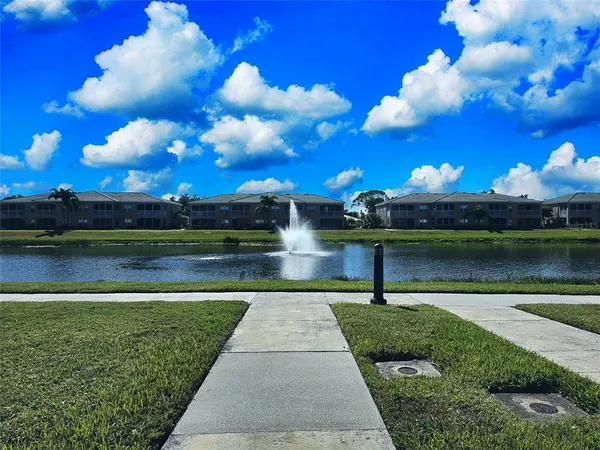 a view of a lake with a yard