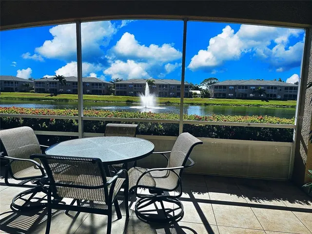 a view of a chairs and table in patio