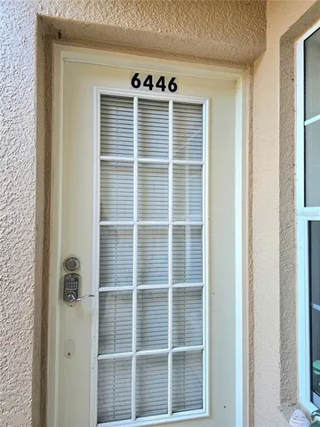 a view of empty room with windows
