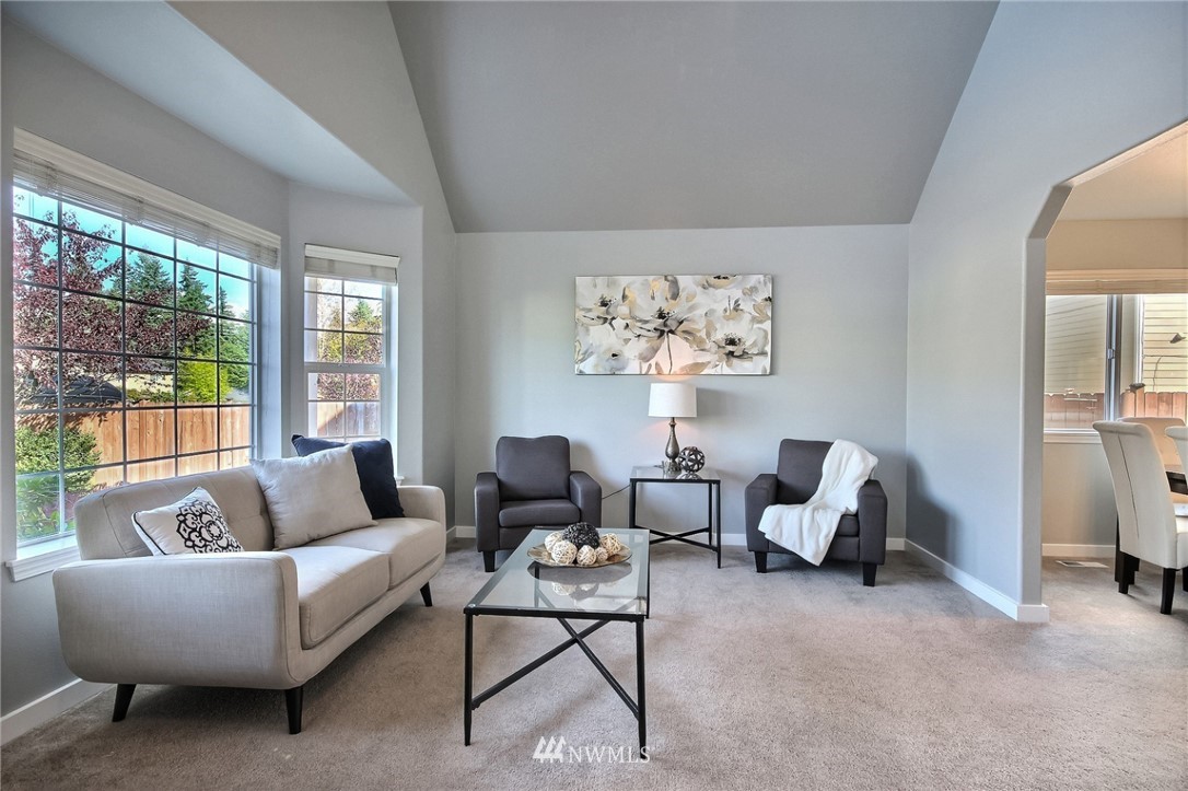 5217 Northeast 11th Street Renton, WA 98059 - Photo 11 of 25 a living room with furniture and a large window