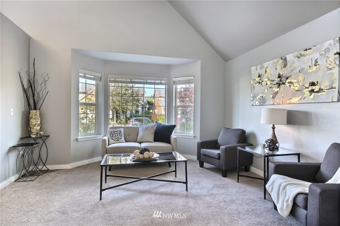 5217 Northeast 11th Street Renton, WA 98059 - Photo 12 of 25 a living room with furniture and a large window