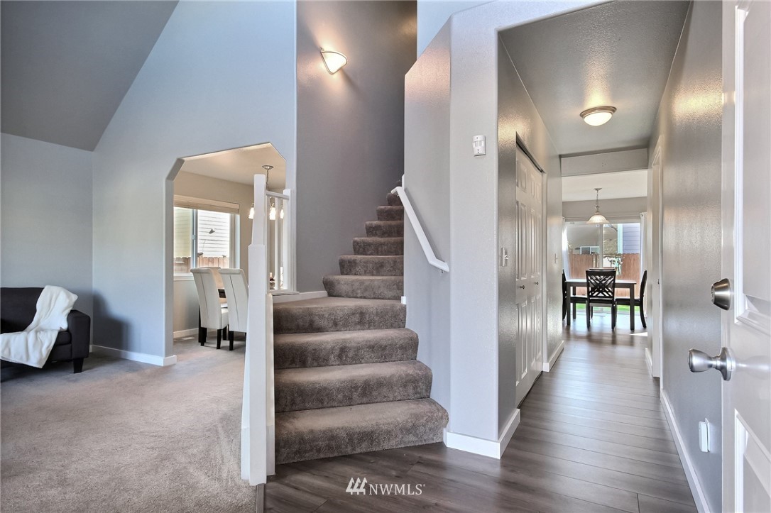 5217 Northeast 11th Street Renton, WA 98059 - Photo 14 of 25 a view of a livingroom with furniture and stairs
