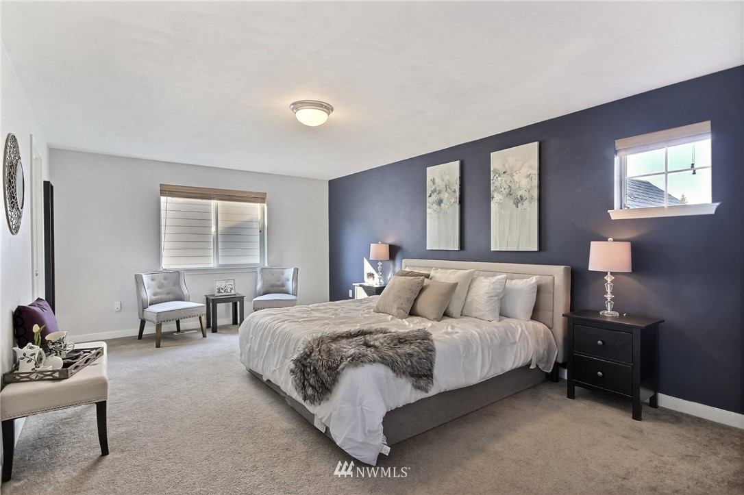 5217 Northeast 11th Street Renton, WA 98059 - Photo 15 of 25 a bedroom with bed and a couch