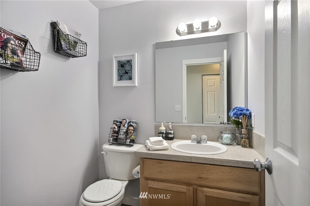 5217 Northeast 11th Street Renton, WA 98059 - Photo 20 of 25 a bathroom with a sink and a mirror