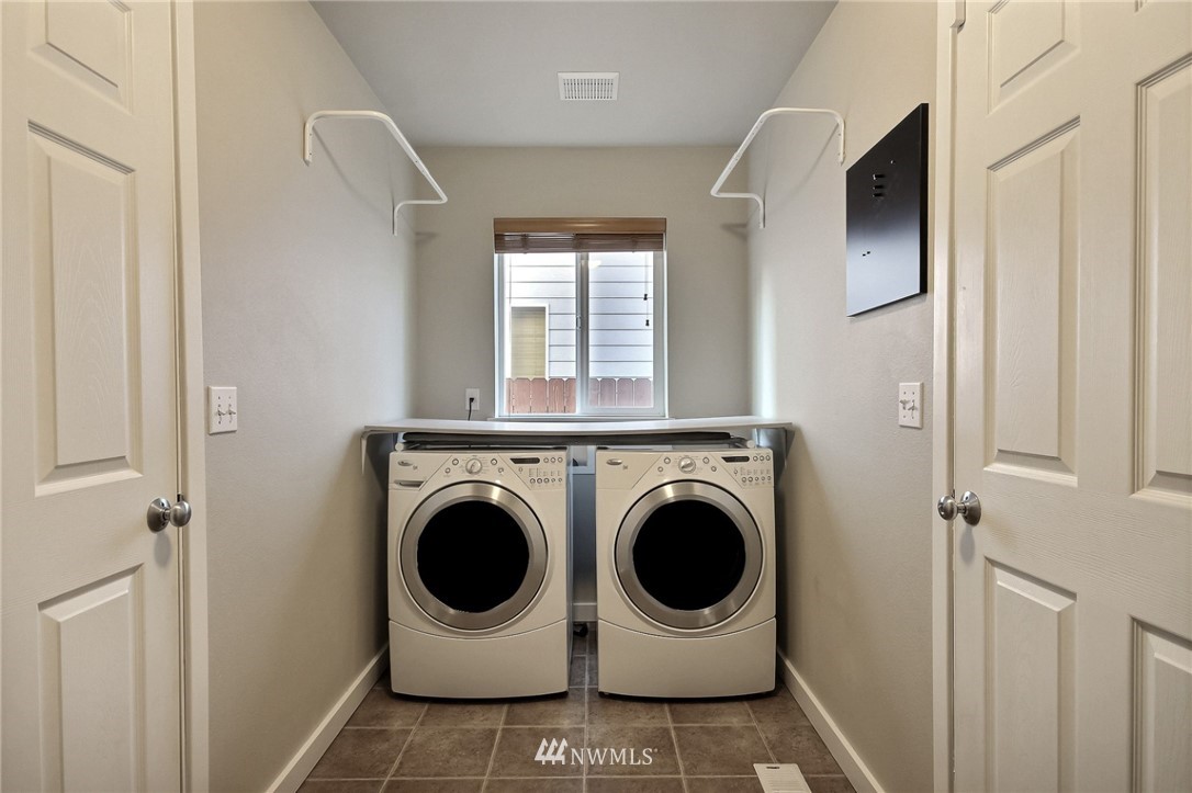 5217 Northeast 11th Street Renton, WA 98059 - Photo 22 of 25 a utility room with dryer and washer
