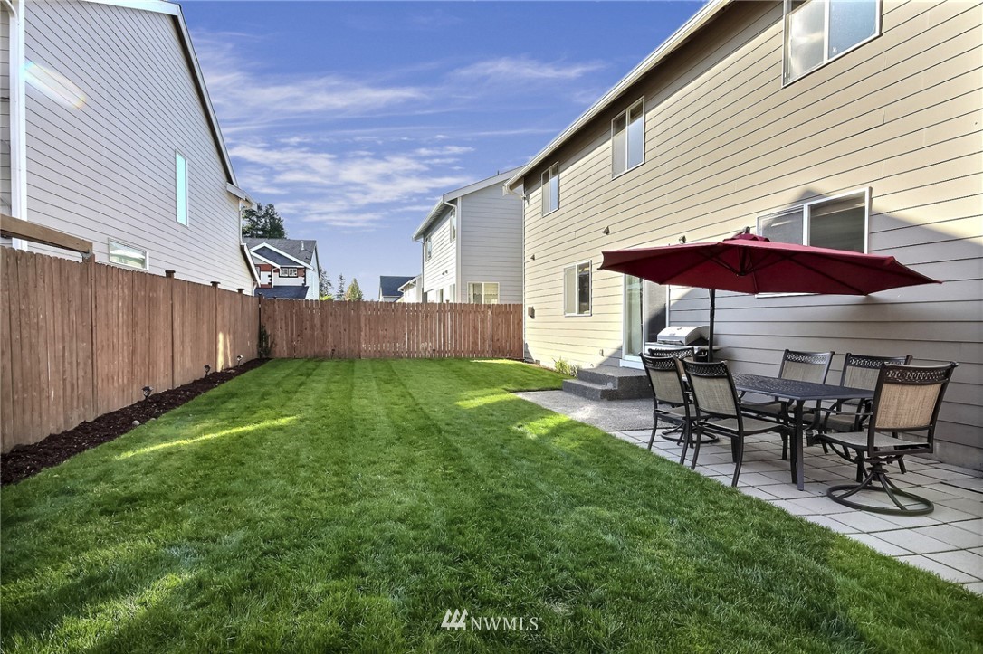 5217 Northeast 11th Street Renton, WA 98059 - Photo 24 of 25 a view of a house with backyard and sitting area