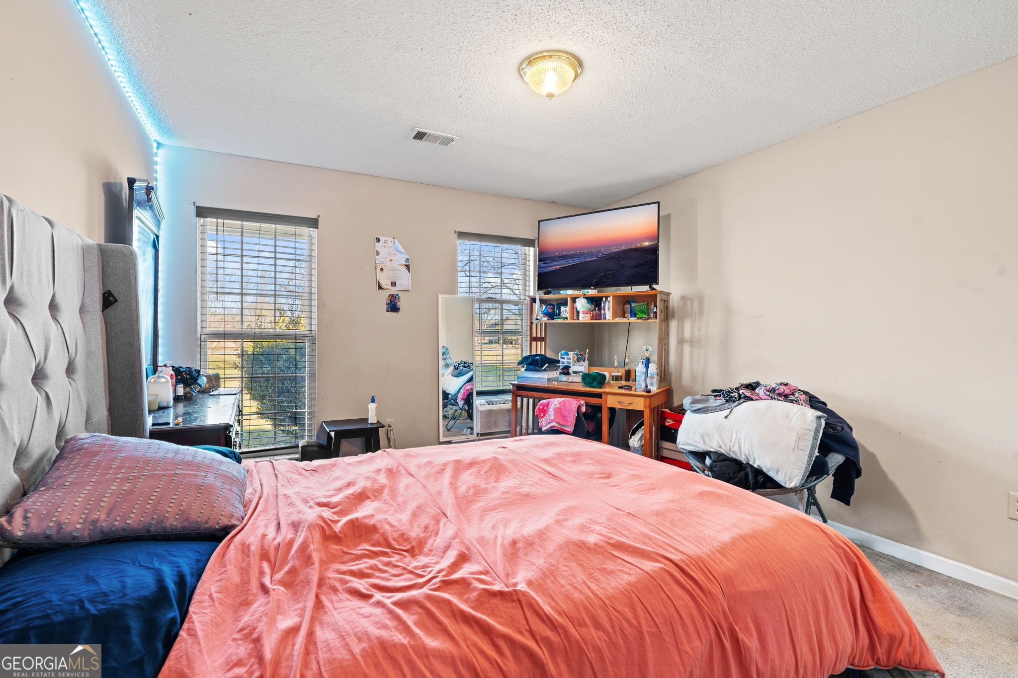 1525 Taylors Mill Road Fort Valley, GA 31030 - Photo 11 of 26 a bedroom with bed and a window