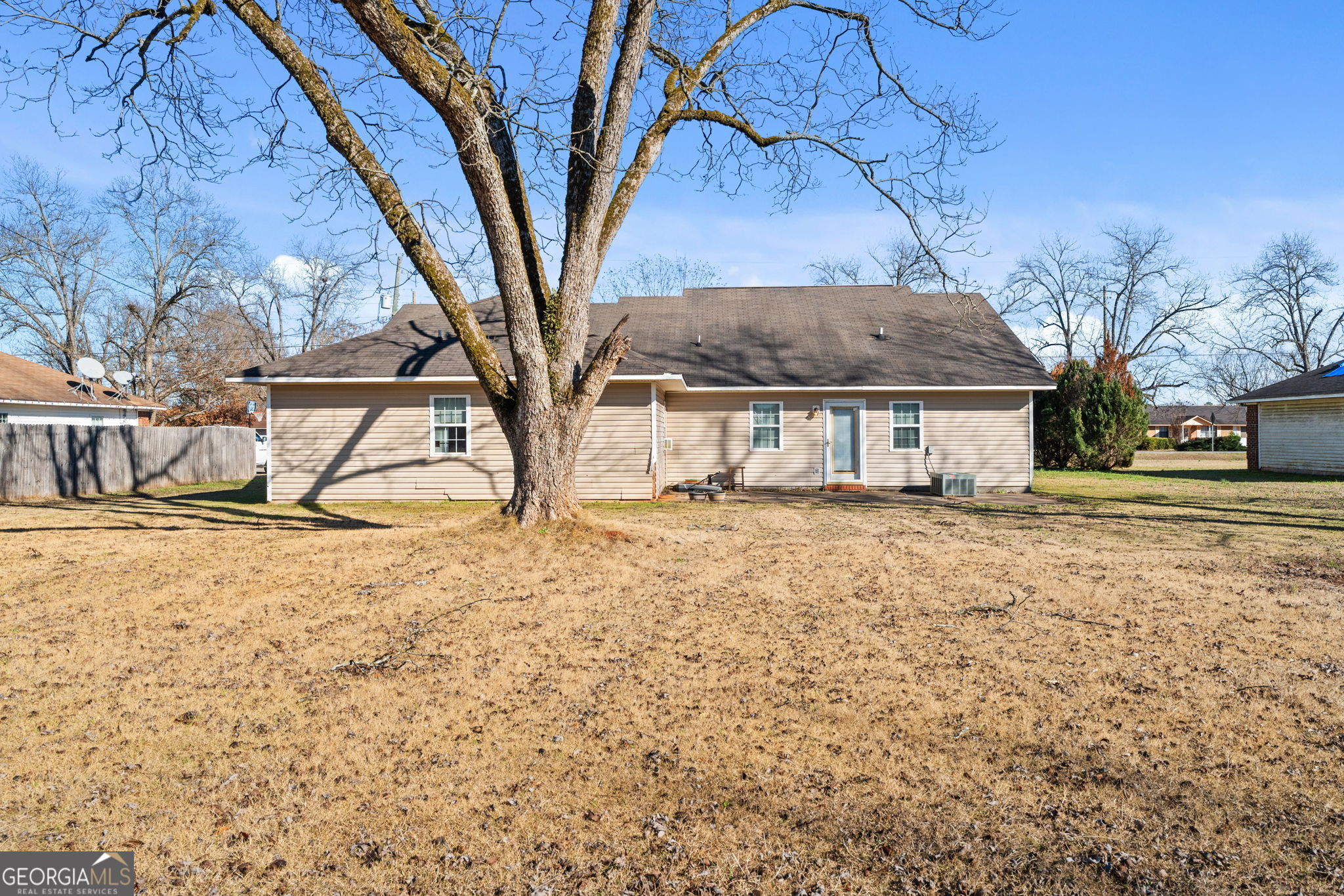 1525 Taylors Mill Road Fort Valley, GA 31030 - Photo 12 of 26 a house that has a tree in front of it