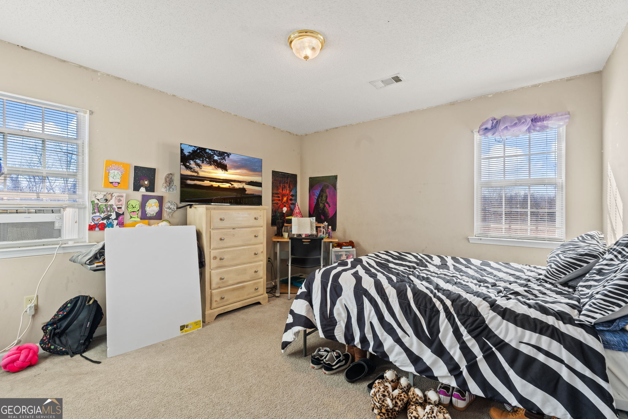 1525 Taylors Mill Road Fort Valley, GA 31030 - Photo 14 of 26 a bedroom with furniture and a window