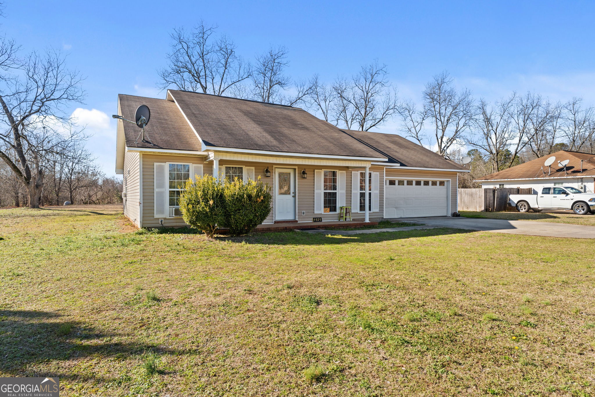 1525 Taylors Mill Road Fort Valley, GA 31030 - Photo 2 of 26 a front view of a house with a yard