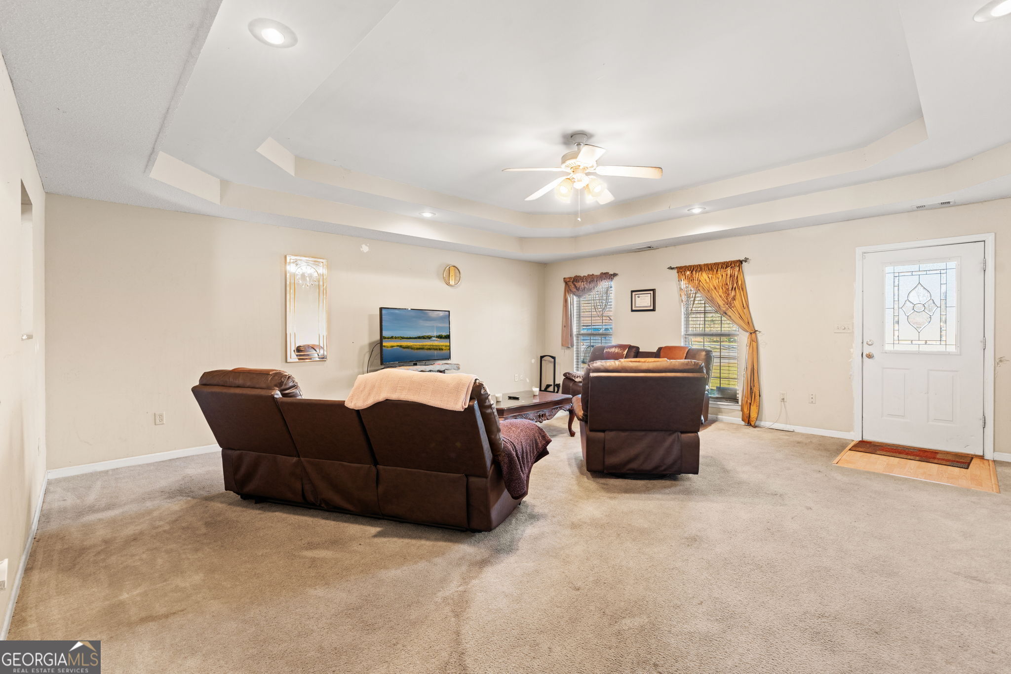 1525 Taylors Mill Road Fort Valley, GA 31030 - Photo 7 of 26 a living room with furniture and a chandelier