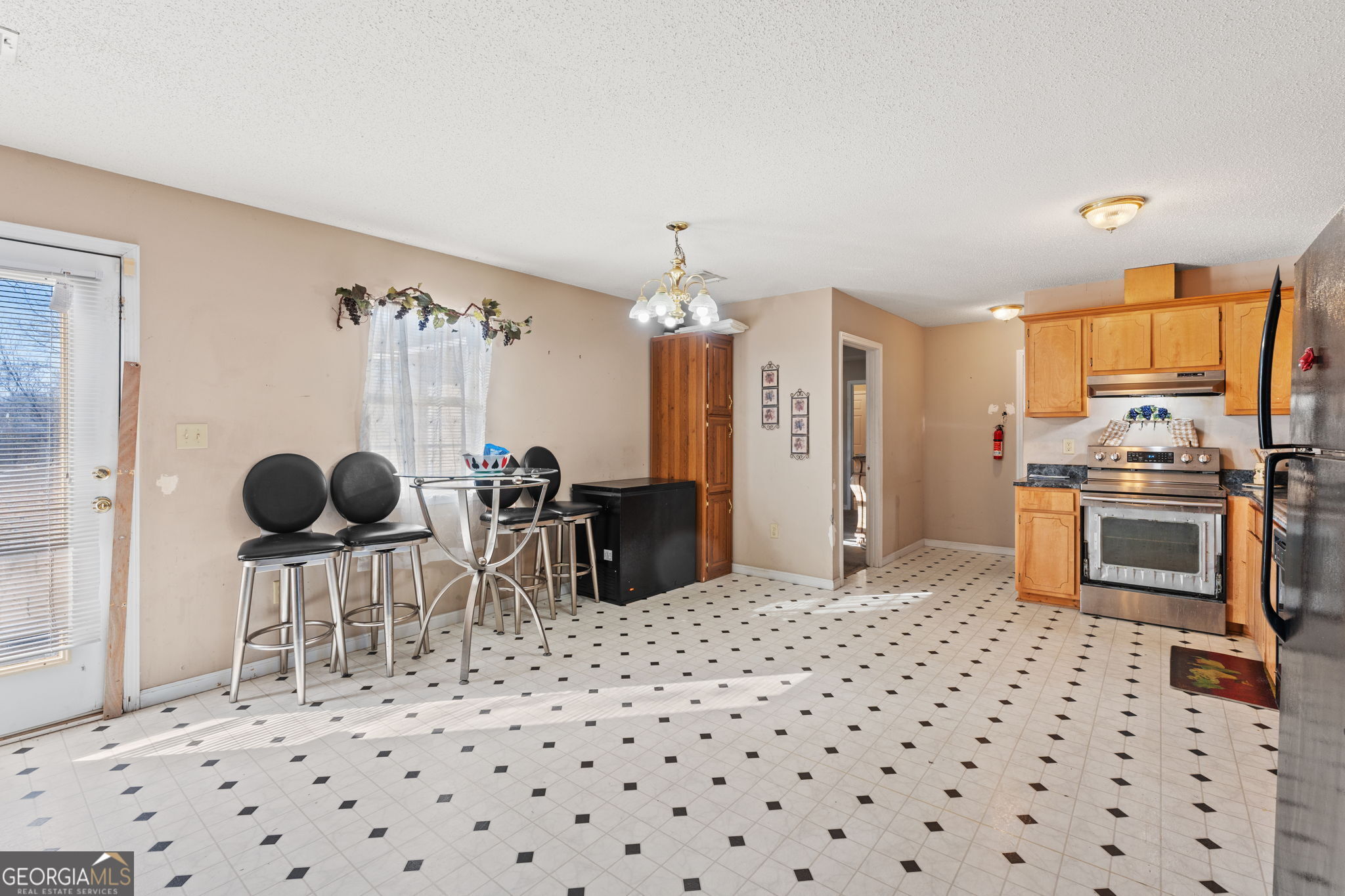 1525 Taylors Mill Road Fort Valley, GA 31030 - Photo 9 of 26 a kitchen with granite countertop a sink cabinets and stainless steel appliances