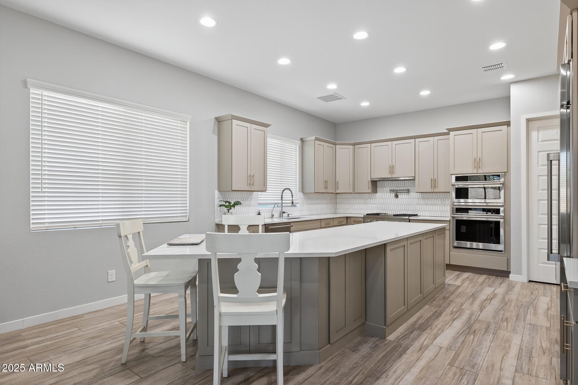 20194 East Raven Drive Queen Creek, AZ 85142 - Photo 11 of 39 a kitchen with stainless steel appliances granite countertop a sink and stove