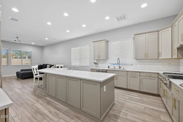 a kitchen with a sink and cabinets