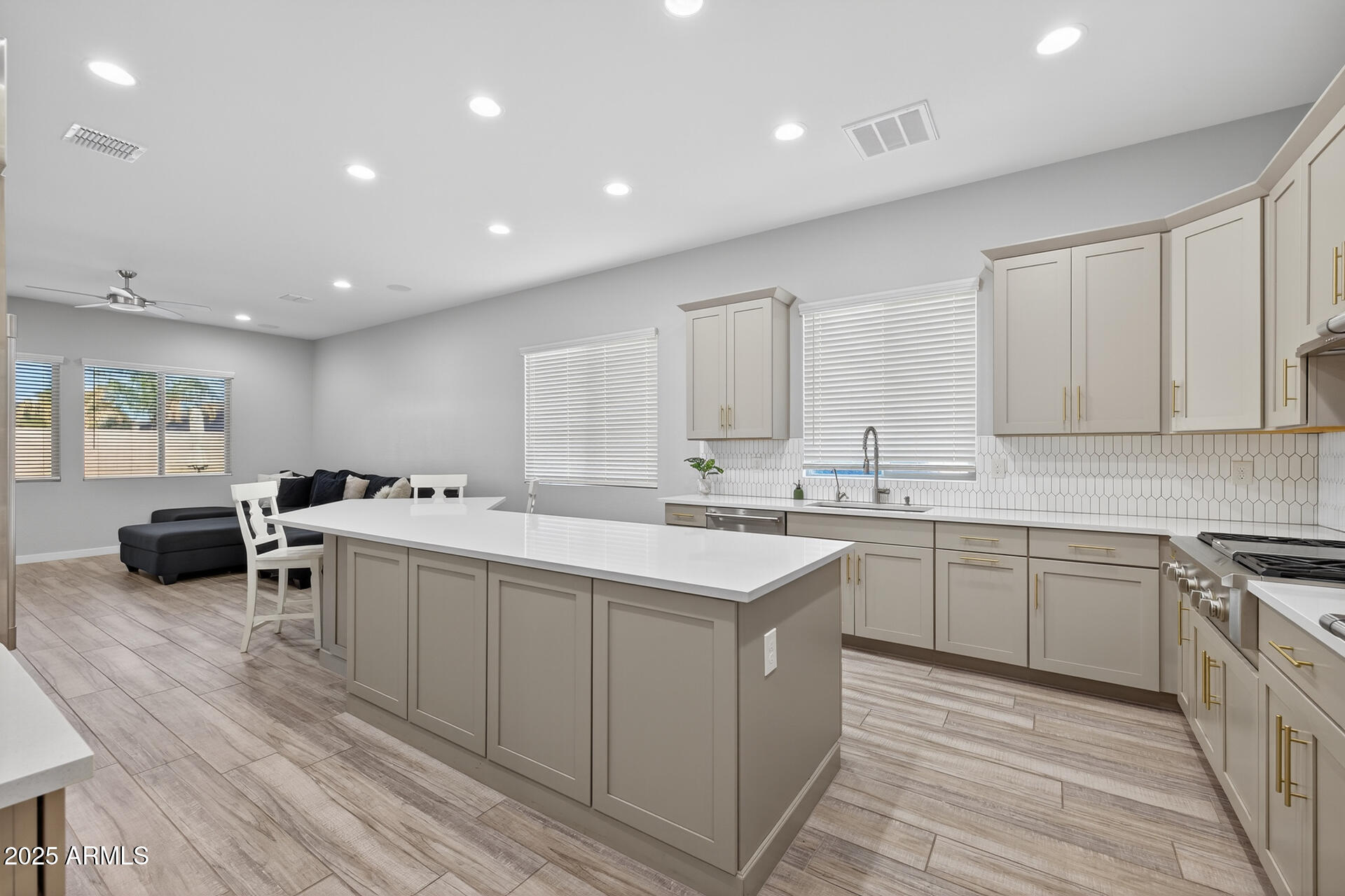 20194 East Raven Drive Queen Creek, AZ 85142 - Photo 12 of 39 a kitchen with a sink and cabinets