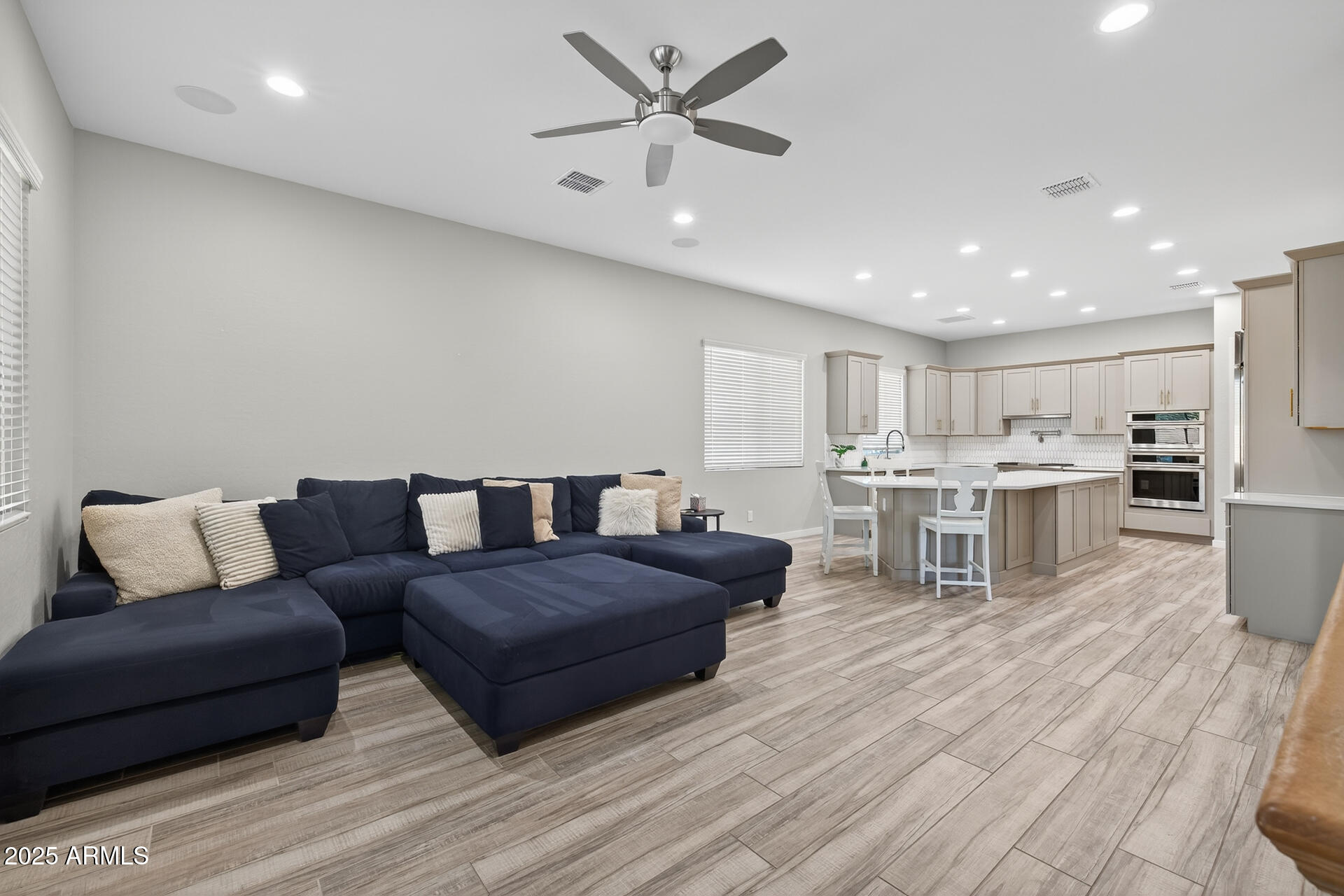 20194 East Raven Drive Queen Creek, AZ 85142 - Photo 17 of 39 a living room with furniture and kitchen view