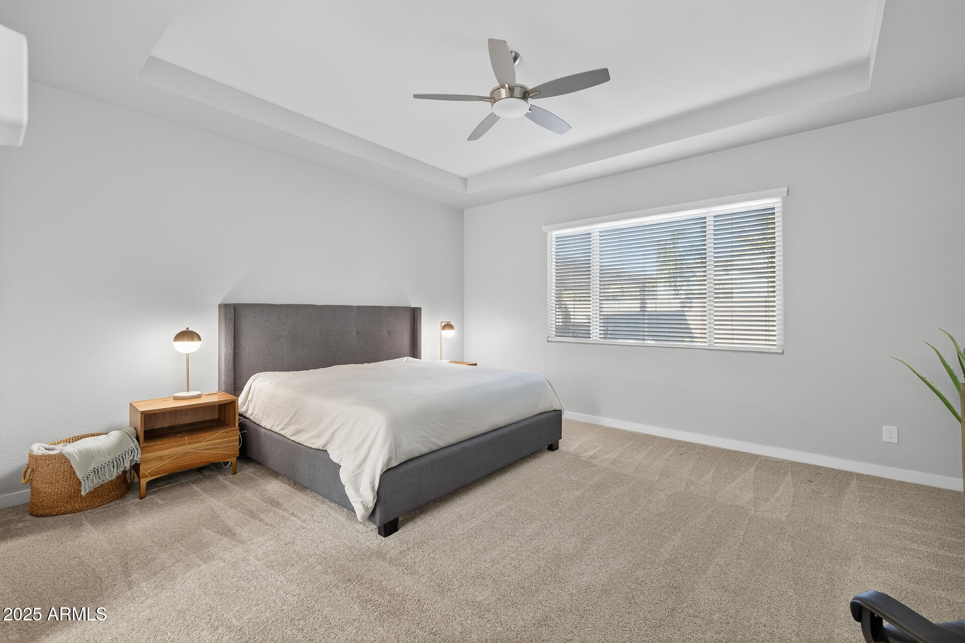 20194 East Raven Drive Queen Creek, AZ 85142 - Photo 18 of 39 a bedroom with a bed lamp and a ceiling fan