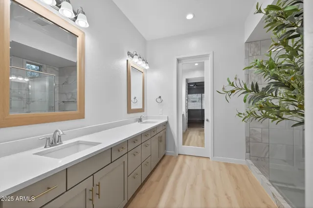 a bathroom with a sink and a mirror