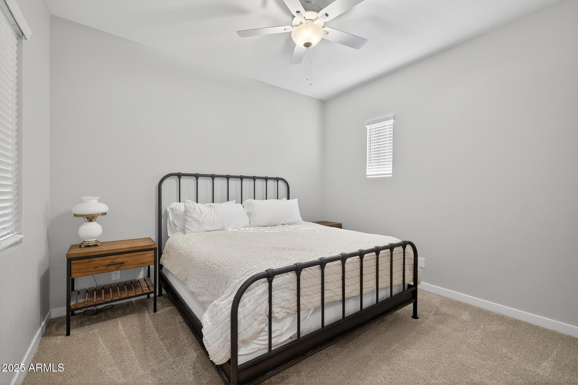 20194 East Raven Drive Queen Creek, AZ 85142 - Photo 25 of 39 a bedroom with a bed table and lamp