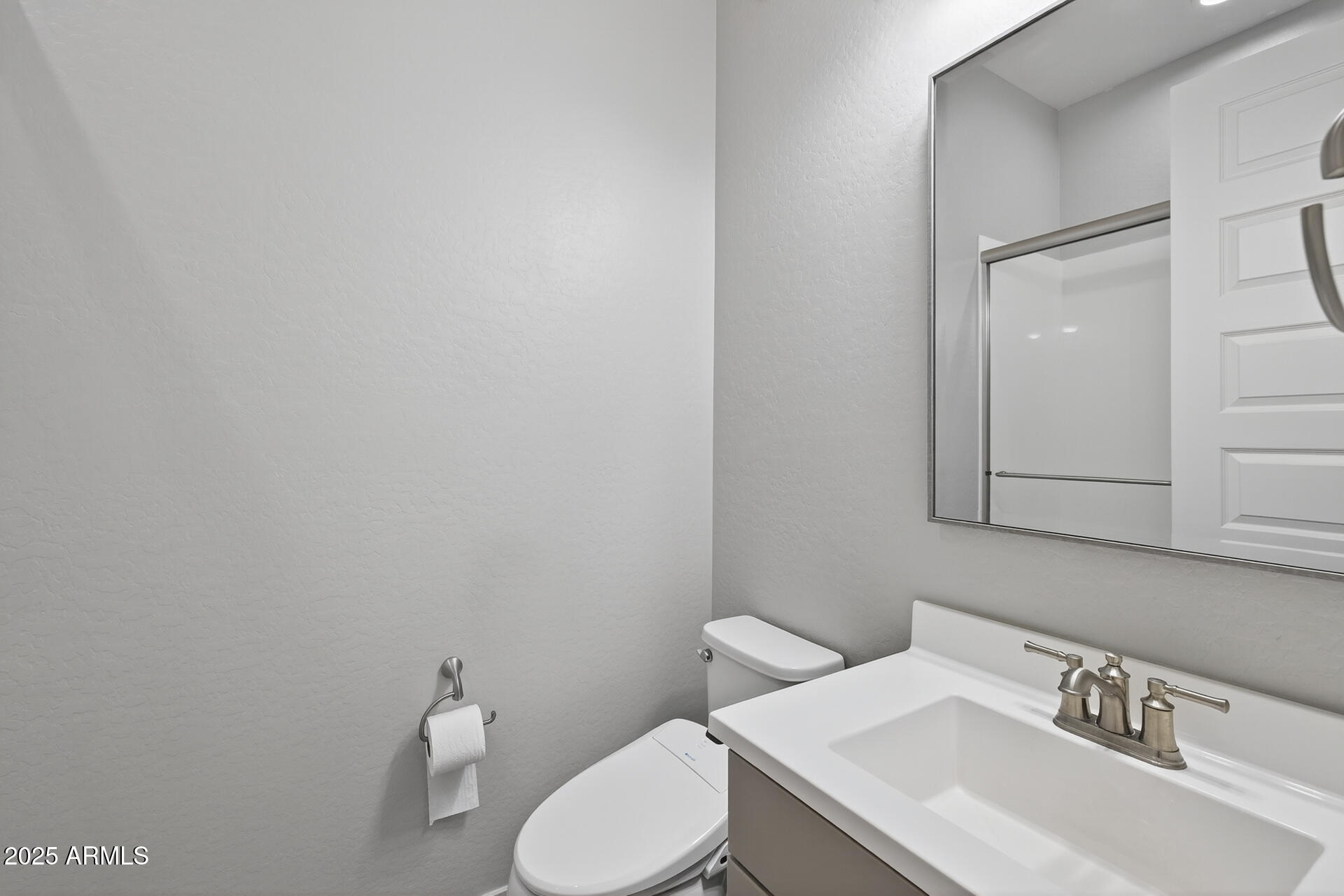 20194 East Raven Drive Queen Creek, AZ 85142 - Photo 26 of 39 a white toilet sitting next to a bathroom sink