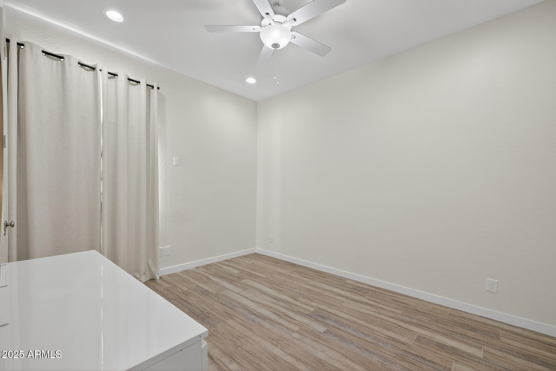 20194 East Raven Drive Queen Creek, AZ 85142 - Photo 27 of 39 a view of a room with wooden floor and fan