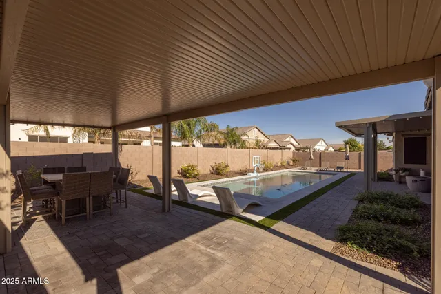 an outdoor sitting area with furniture