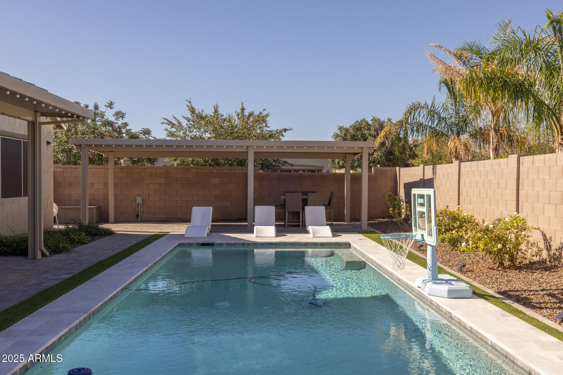 20194 East Raven Drive Queen Creek, AZ 85142 - Photo 35 of 39 a view of a patio with couches table and chairs with wooden floor and fence