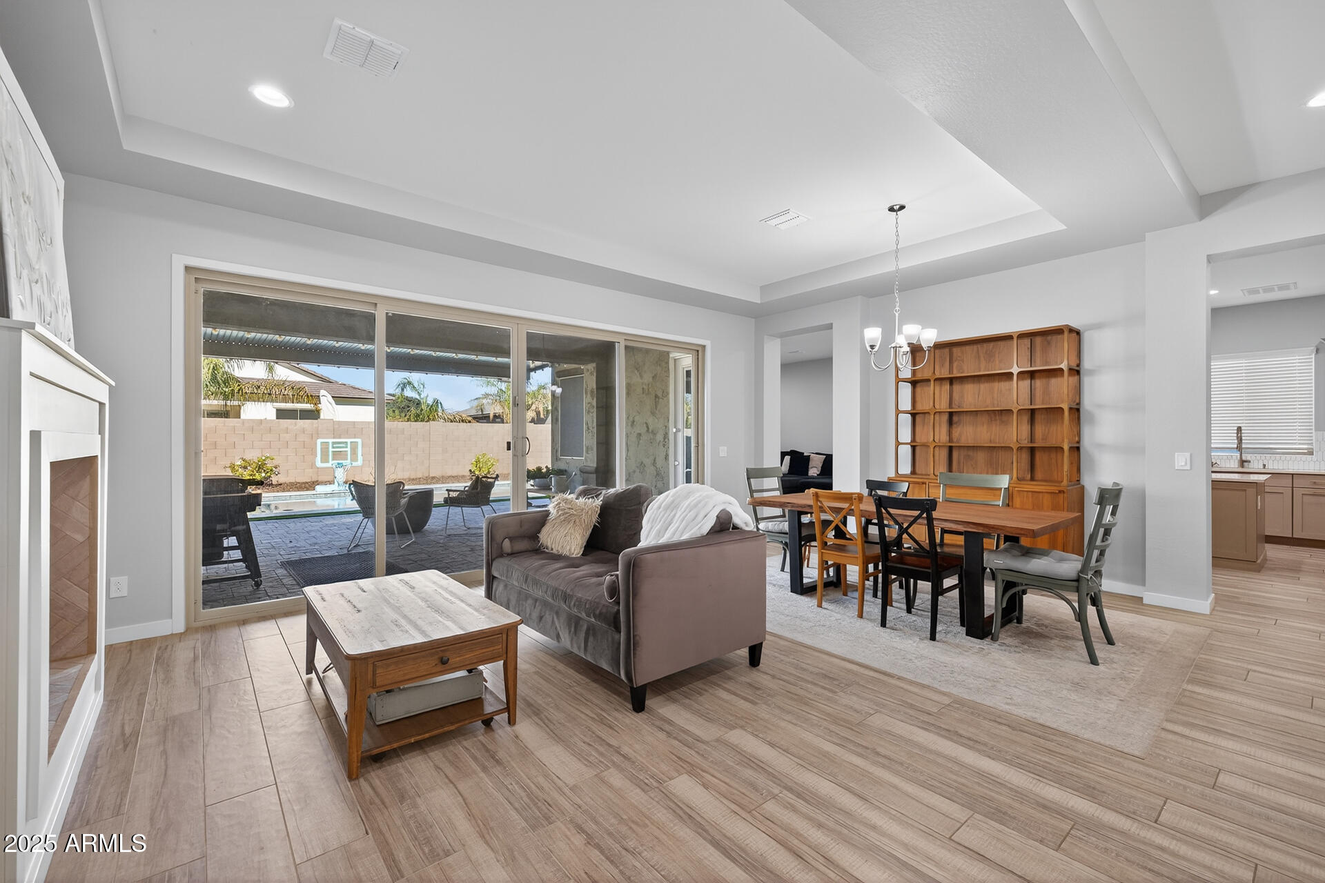 20194 East Raven Drive Queen Creek, AZ 85142 - Photo 6 of 39 a living room with furniture and a wooden floor