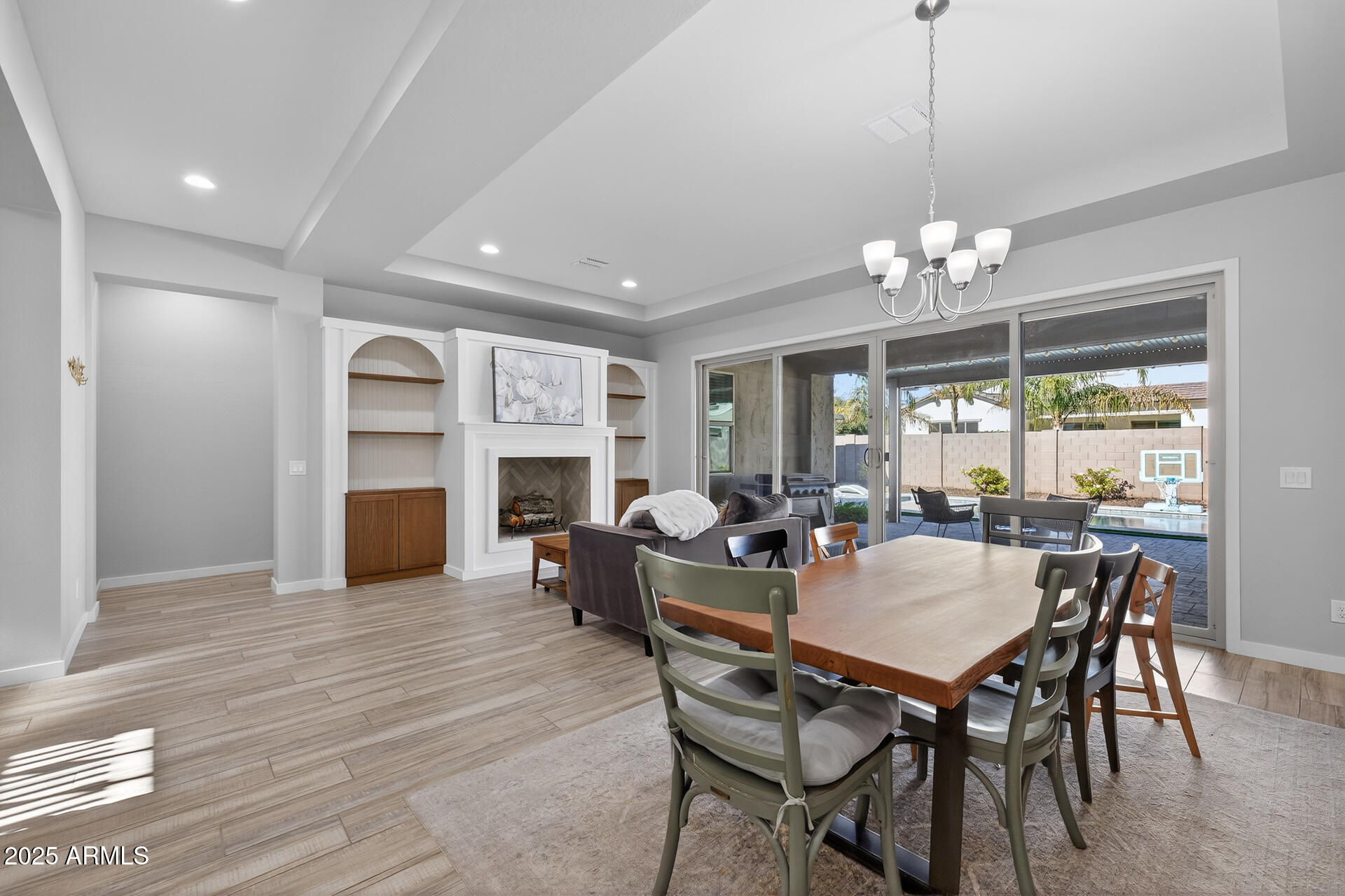 20194 East Raven Drive Queen Creek, AZ 85142 - Photo 9 of 39 a view of a dining room with furniture window and wooden floor