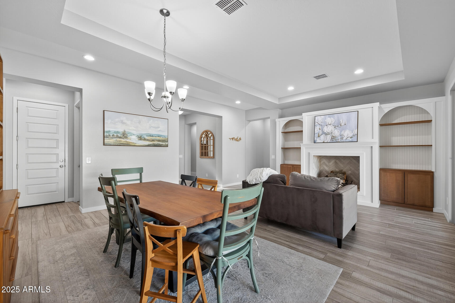 20194 East Raven Drive Queen Creek, AZ 85142 - Photo 10 of 39 a view of a dining room with furniture and wooden floor
