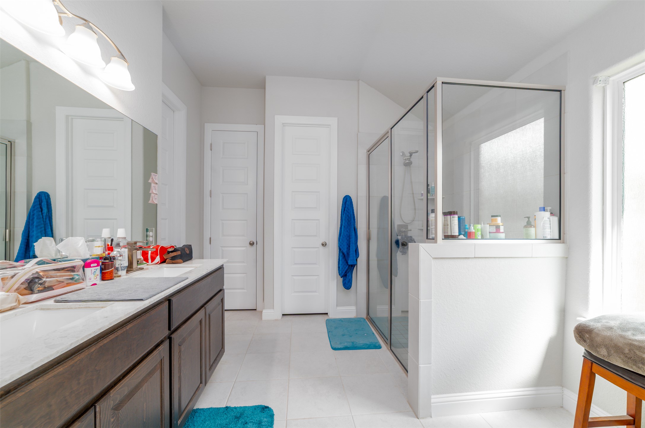 273 Rimrock Court Bastrop, TX 78602 - Photo 13 of 17 a bathroom with a sink mirror and a shower