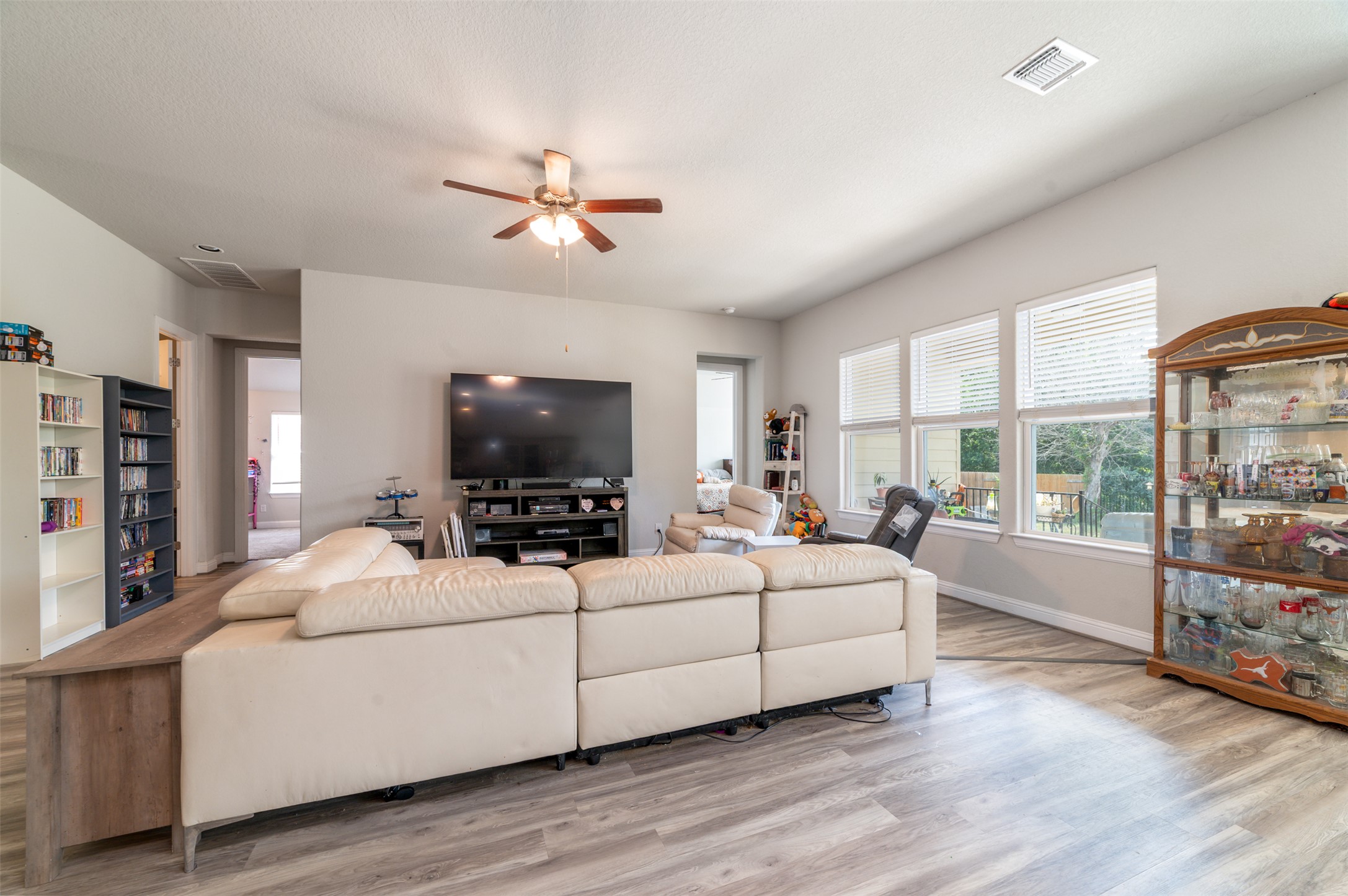 273 Rimrock Court Bastrop, TX 78602 - Photo 3 of 17 a living room with furniture and a flat screen tv