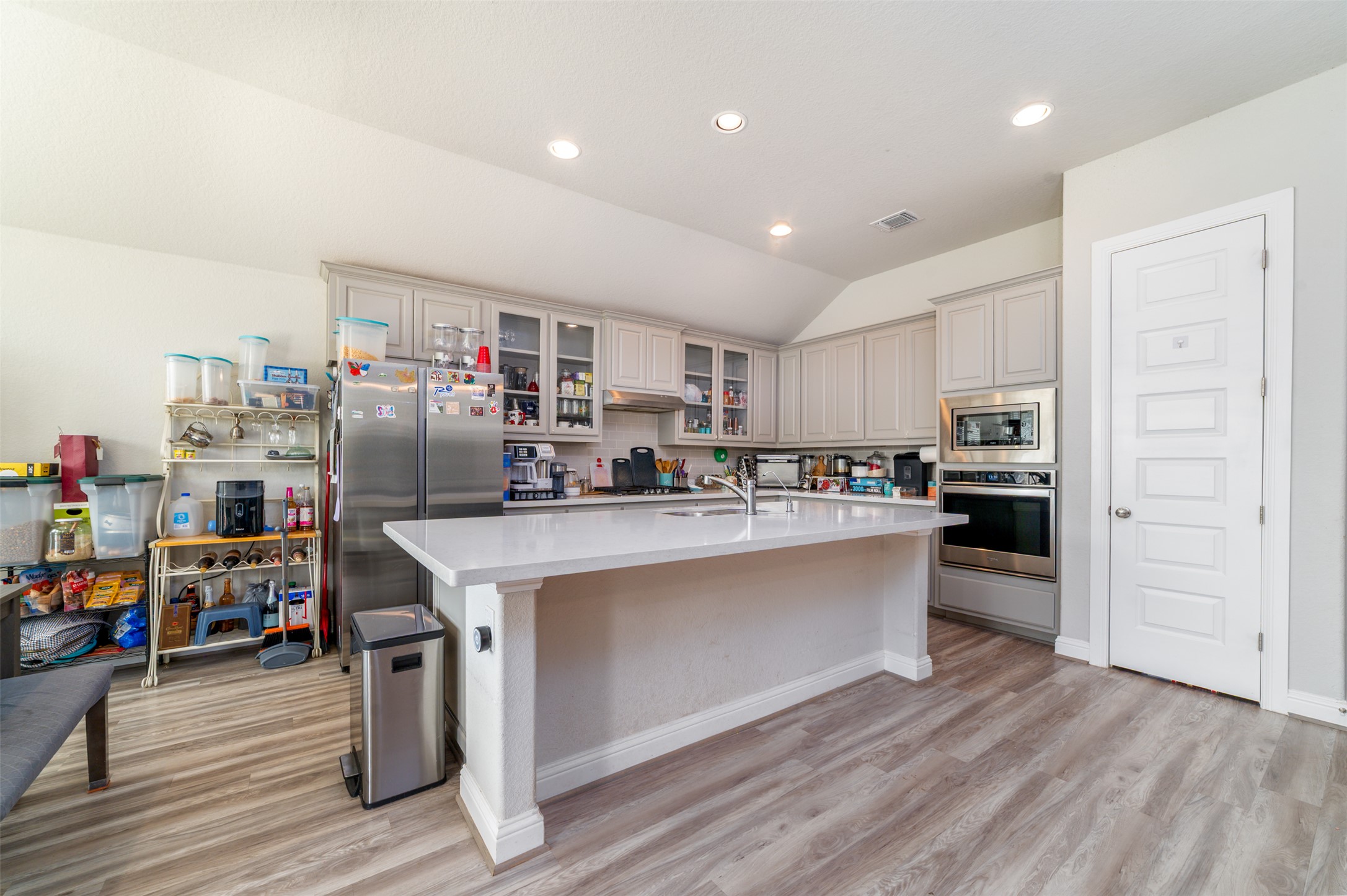 273 Rimrock Court Bastrop, TX 78602 - Photo 5 of 17 a kitchen with stainless steel appliances a refrigerator and a stove top oven