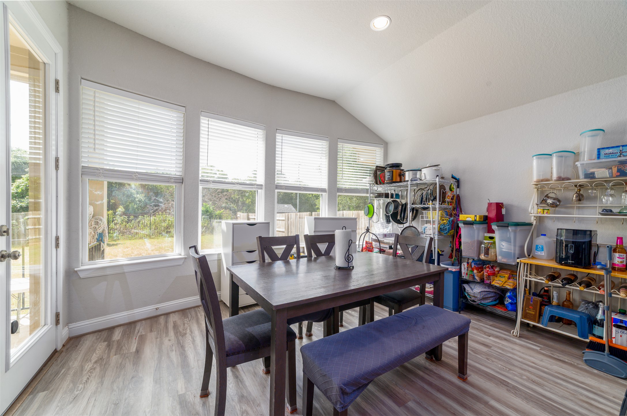 273 Rimrock Court Bastrop, TX 78602 - Photo 6 of 17 a view of a dining room with furniture and a floor to ceiling window