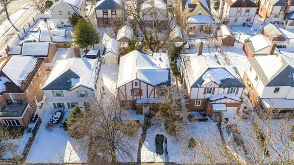 an aerial view of residential houses with outdoor space