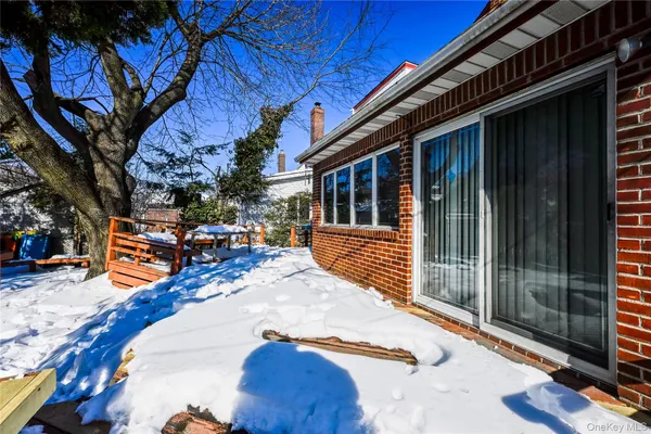 a view of a house with wooden fence