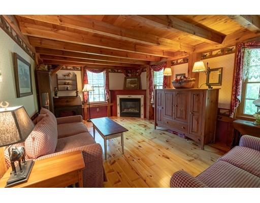 87 Saundersdale Road Charlton, MA 01507 - Photo 11 of 30 a view of a livingroom with furniture and a fireplace