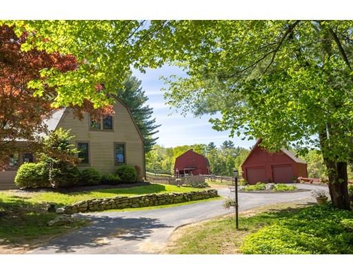 87 Saundersdale Road Charlton, MA 01507 - Photo 2 of 30 a front view of house with yard and trees