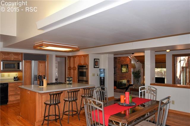 80 Midland Road Colorado Springs, CO 80906 - Photo 25 of 25 Kitchen is open to the hearth room - Open and bright floor plan