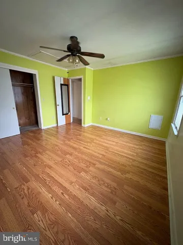 a bathroom with a toilet sink double vanity and mirror