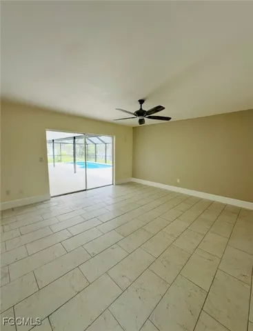 an empty room with a empty space and windows