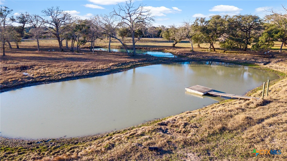1465 County Road 401 Edna, TX 77957 - Photo 40 of 46 a view of a lake with a mountain