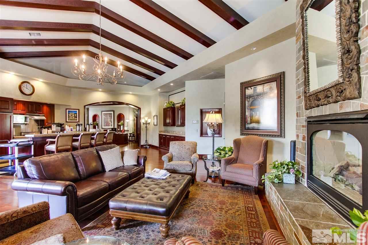 900 S, Unit 3114 Reno, NV 89521 - Photo 14 of 18 a living room with furniture and a chandelier