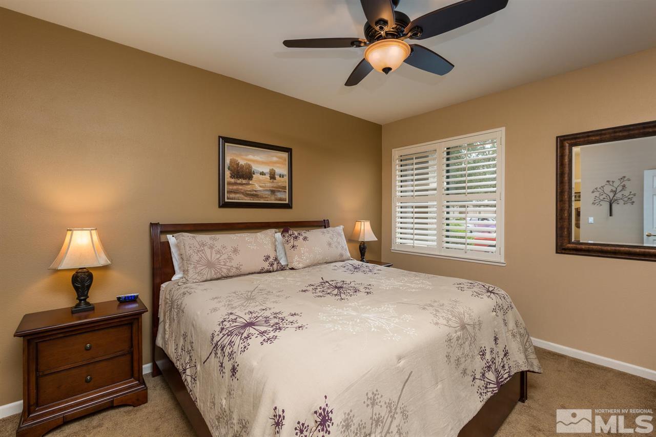 900 S, Unit 3114 Reno, NV 89521 - Photo 5 of 18 a bedroom with a bed and a chandelier