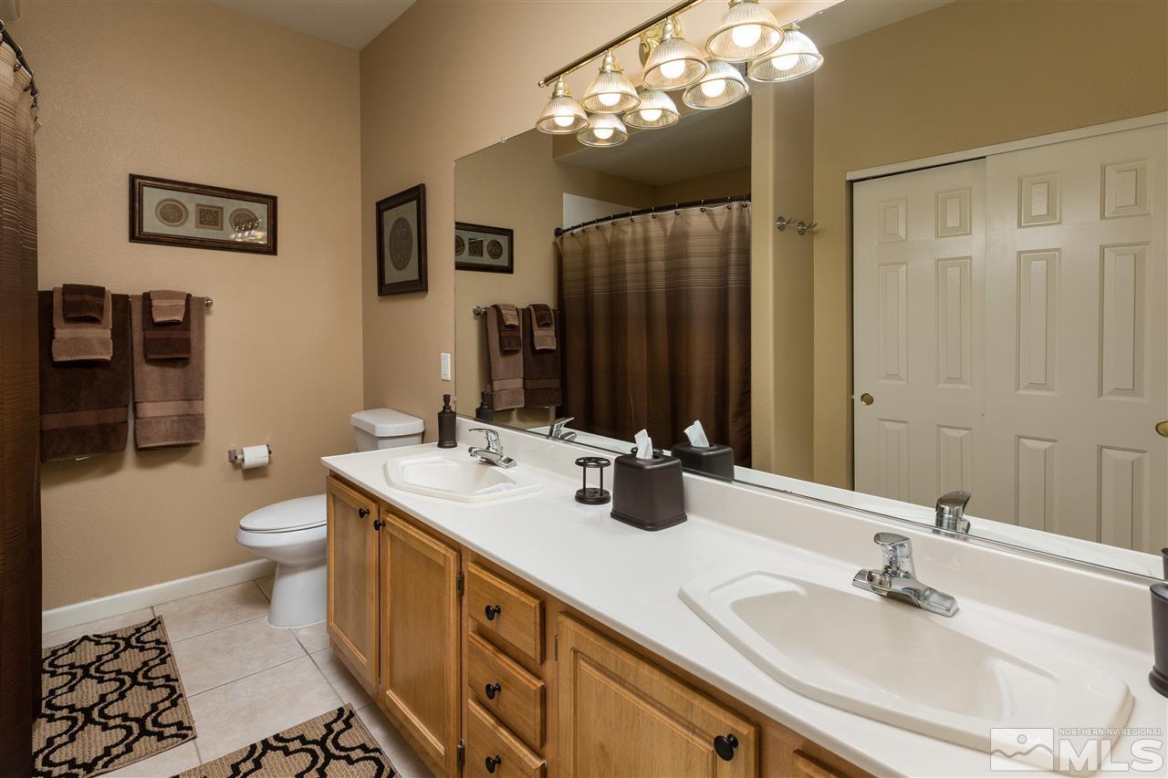 900 S, Unit 3114 Reno, NV 89521 - Photo 6 of 18 a bathroom with a double vanity sink mirror and toilet