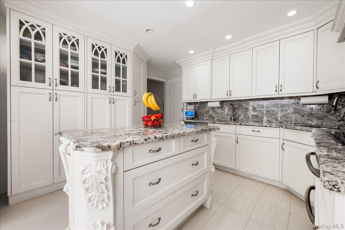 70 Longfellow Road Great Neck, NY 11023 - Photo 7 of 28 a view of cabinets a sink and a stove in a kitchen