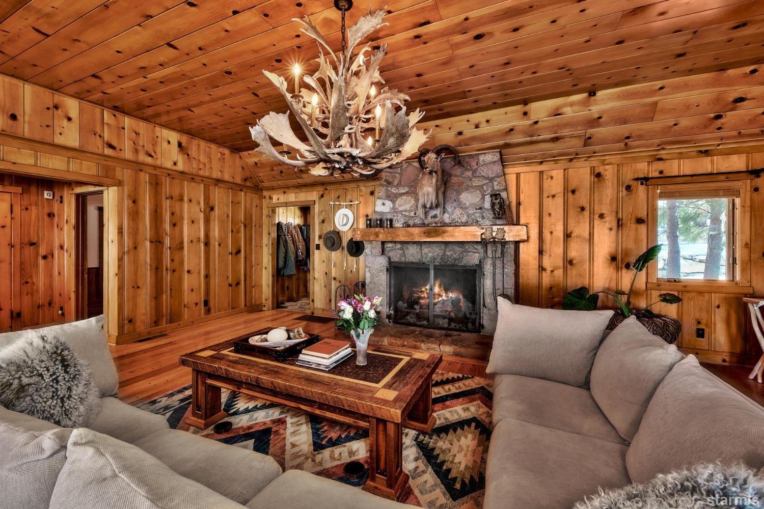 1472 Flowers Glenbrook, NV 89413 - Photo 15 of 25 a living room with furniture a table and a fireplace